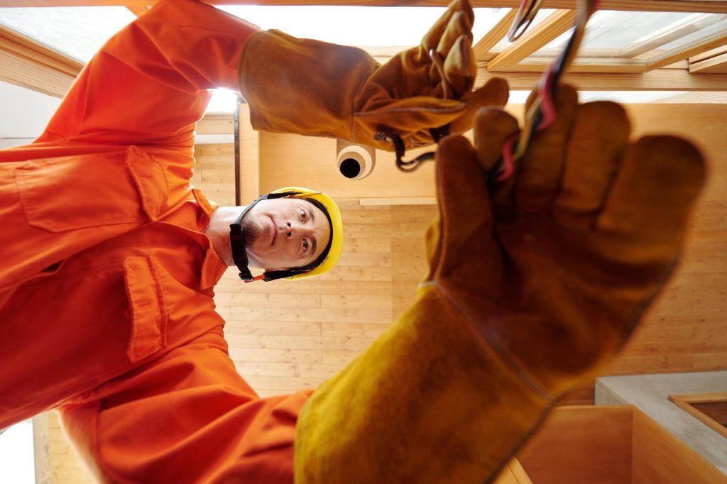 Electrician Conducting Electricity in New House